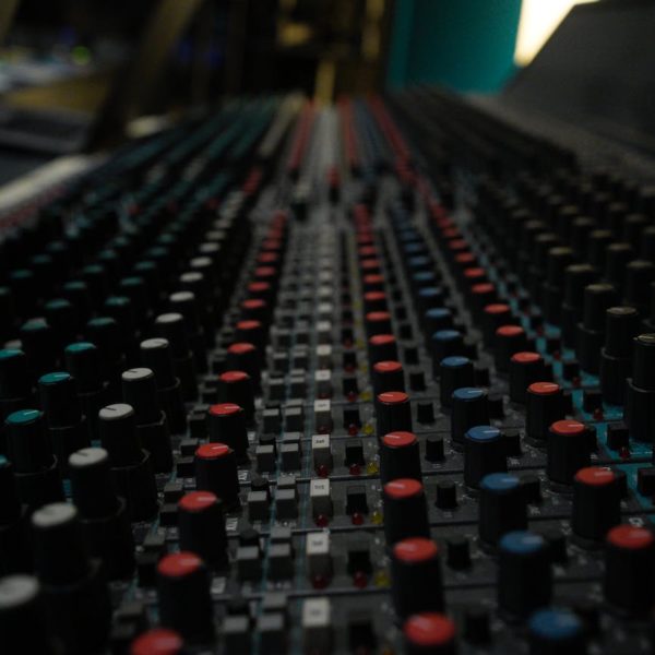 close up of buttons on a console in a music studio